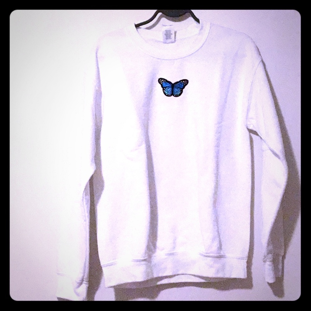 White sweatshirt with a blue butterfly